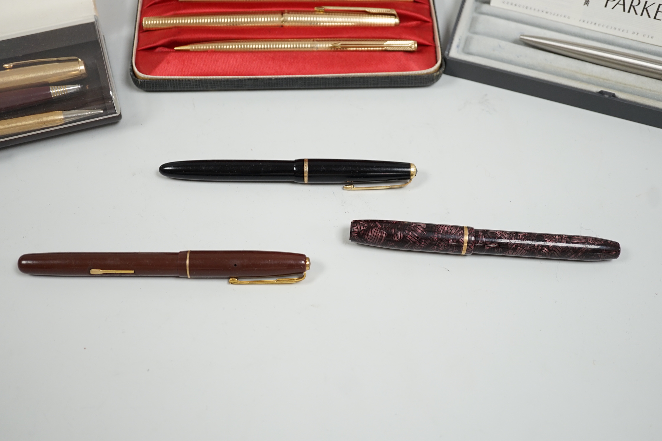 A Parker gold plated pen/pencil biro set and other Parker pens